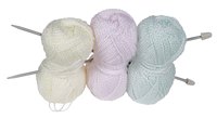 A blanket knit in pretty pastels and finished with a ruffle can be a baby gift.