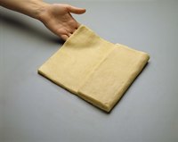 Repeated rolling and folding gives puff pastry or croissant dough its flakiness.