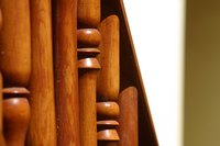 Add a wooden railing to your knee wall to protect against falls and to add an attractive stairway accent.