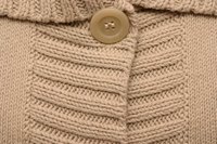 Closures and neckline influence the kind of collar that can be added to a sweater.
