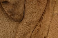 Turn burlap fabric into a wall covering.