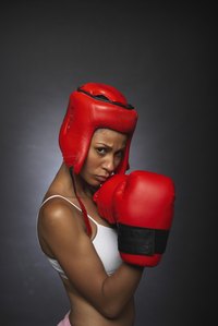 Make large costume boxing gloves at home with red socks.