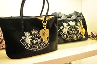 The Juicy Couture logo is usually splashed on the outside of the bag.