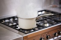 Steam rising from pot on stovetop