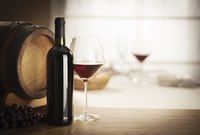 Bottle and glass of red wine.