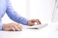 Businessman typing at keyboard