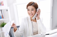 A business woman is on the phone.