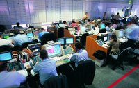 Stock brokers working at the stock exchange office.