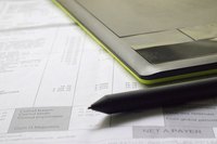 A calculator and pen are sitting on top of a credit report.