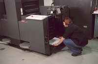 A woman in a commercial print shop