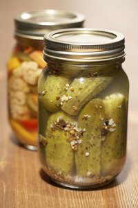 The familiar pop of a two-piece canning jar ensures an airtight seal.
