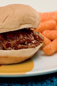 Serve pulled pork with sides dishes to your guests.