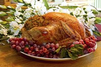 Thanksgiving turkey on dinner table.
