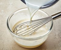 Pour sauce into a glass bowl with a whisk.
