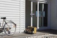 Seal the exterior of a sliding glass door to prevent drafts.