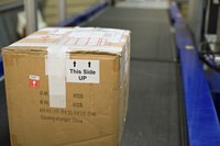 Box on a convertor belt ready for shipping.