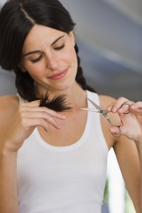 Cut split ends off yourself or visit a professional for a uniform look.