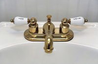 Shiny polished brass gives a bathroom an elegant touch.