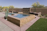 A homemade hot tub can accent your pool deck or be an oasis unto itself.