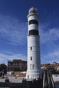 Create a colorful lighthouse with paper towel rolls.