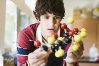 A student is working with a DNA model.