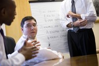 Business people having a discussion in a conference room.