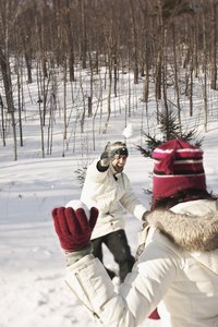 Make a pair of knit gloves to keep your hands warm while you are playing in the snow.