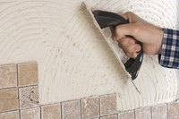 Installing tile over concrete walls is possible but presents some unique challenges.