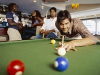 Playing pool in a sports bar.