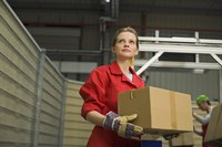Woman holding a box in a warehouse