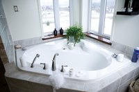 Some corner bathtubs seat two to three people.