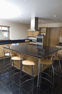 Run new wire to your kitchen island through the basement or crawl space.
