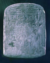 Hieroglyphics, carved on an ancient Egyptian stone tablet.