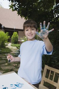 A child's handprints on canvas gives the craft a polished and professional look.