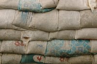 Sew a casing along the top of a flour or coffee sack or add tabs to a quilt to make simple, primitive curtains.