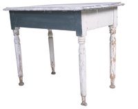 Distressed painted furniture gives a room a feel of lived-in comfort.
