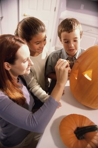 Carve a pumpkin with friends as a Halloween tradition.