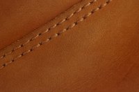 Use a soft touch when cleaning designer leather.