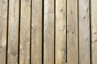 Bare wooden planks accentuate natural colors in a yard.