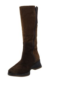 To take your outfit up a notch for a formal event, pair khaki pants with brown boots.