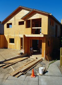 Siding on a house goes up faster with a nail gun.