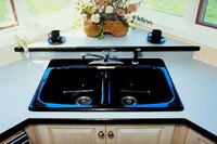 Corner kitchen sink cabinets are generally larger than other base cabinets.