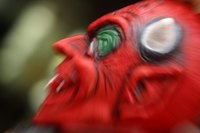 Make a full-head mask out of paper mache.