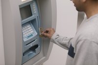 Man using an automatic teller machine.