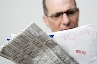 Man looking at past due bill