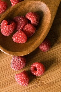 A raspberry fruit is an aggregation of numerous tiny fleshy fruits fused together.