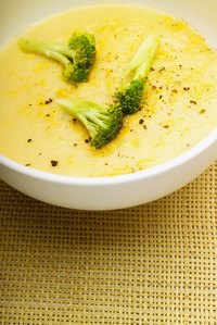 Adding cheese to cream of broccoli soup thickens it.
