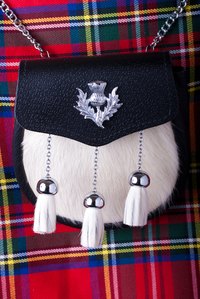 A decorative leather and fur sporran can be worn with a dress kilt.