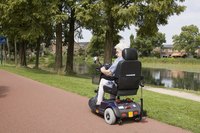 Woman riding on electric scooter