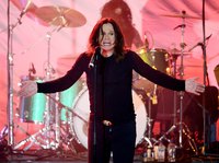 Ozzy Osbourne singing on stage.